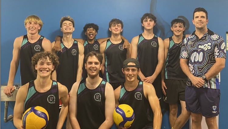 Photo of the boys basketball team and the teacher.