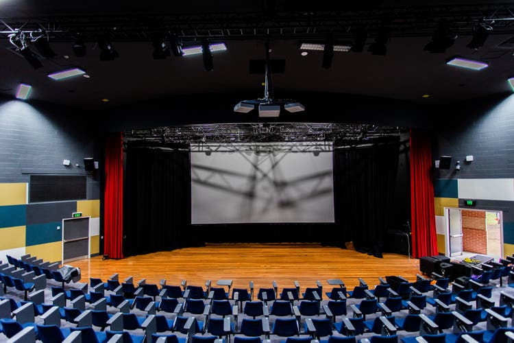 Photo of a stage taken from the seats in the upper level